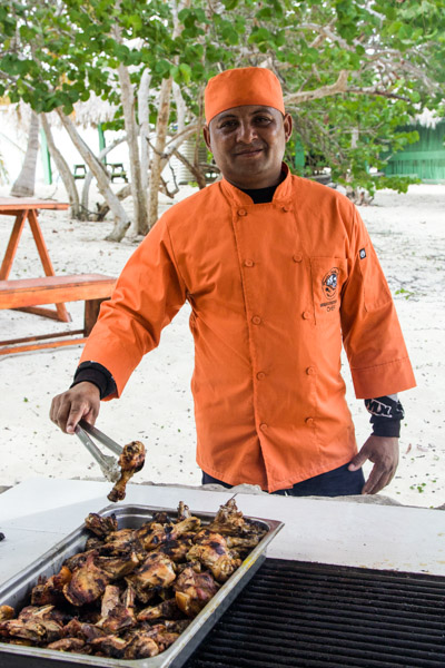 Chef busy at work while guests enjoy their day